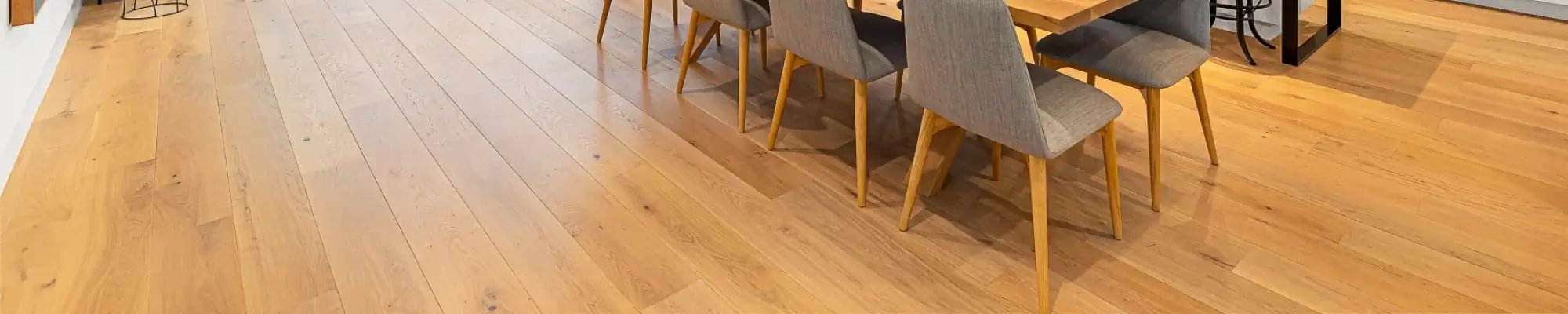 Natural hardwood flooring in a classy dining room of a Wyoming MI home